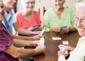 senior group playing cards