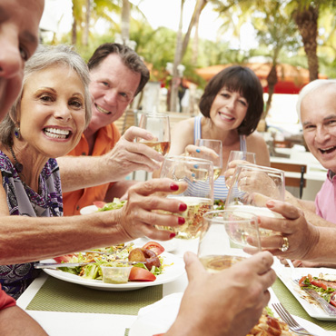 group of seniors happy at lunch