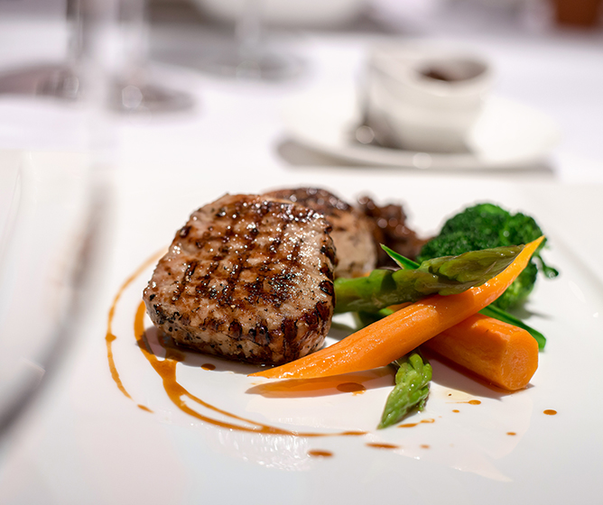 Chef prepared steak with roasted carrots, asparagus and broccoli