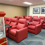 Reclining armchair seating and popcorn cart in our theater