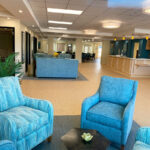 alternate view of front lobby with views of the dining room and front desk