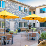 Outdoor view of courtyard with large umbrella covered seating